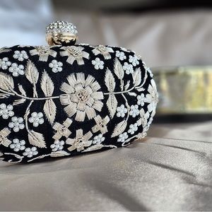 Black velvet hand embroidered clutch.